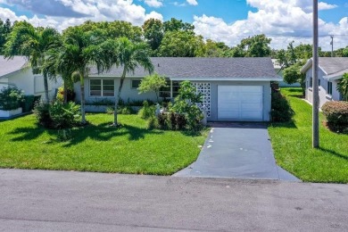 6708 NW 57th Dr on Woodlands Country Club in Florida - for sale on GolfHomes.com, golf home, golf lot