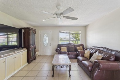 6708 NW 57th Dr on Woodlands Country Club in Florida - for sale on GolfHomes.com, golf home, golf lot