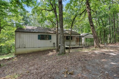 Discover a charming fixer-upper nestled in a secluded, quiet on Mountain Ranch Golf Club in Arkansas - for sale on GolfHomes.com, golf home, golf lot