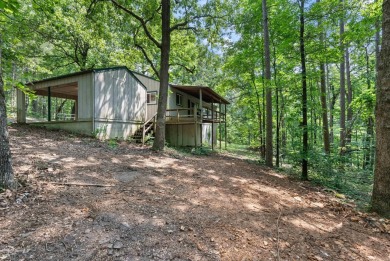 Discover a charming fixer-upper nestled in a secluded, quiet on Mountain Ranch Golf Club in Arkansas - for sale on GolfHomes.com, golf home, golf lot