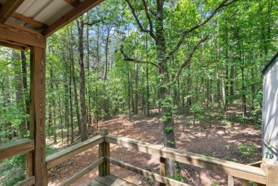 Discover a charming fixer-upper nestled in a secluded, quiet on Mountain Ranch Golf Club in Arkansas - for sale on GolfHomes.com, golf home, golf lot