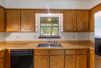 Discover a charming fixer-upper nestled in a secluded, quiet on Mountain Ranch Golf Club in Arkansas - for sale on GolfHomes.com, golf home, golf lot