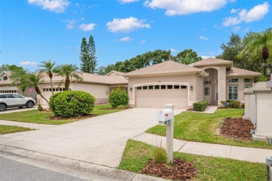 Walk up as you take in the lush landscape and brick paved front on East Lake Woodlands Country Club in Florida - for sale on GolfHomes.com, golf home, golf lot