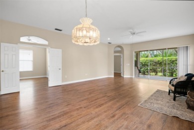 Walk up as you take in the lush landscape and brick paved front on East Lake Woodlands Country Club in Florida - for sale on GolfHomes.com, golf home, golf lot
