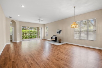 Walk up as you take in the lush landscape and brick paved front on East Lake Woodlands Country Club in Florida - for sale on GolfHomes.com, golf home, golf lot
