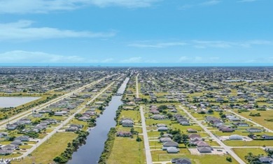 Cape Coral Canal-Front Vacant Lot - Perfect for a Future on Del Tura Golf and Country Club in Florida - for sale on GolfHomes.com, golf home, golf lot