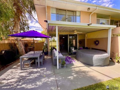 Floor to ceiling windows capture the relaxing golf course views on Yuma Golf and Country Club in Arizona - for sale on GolfHomes.com, golf home, golf lot