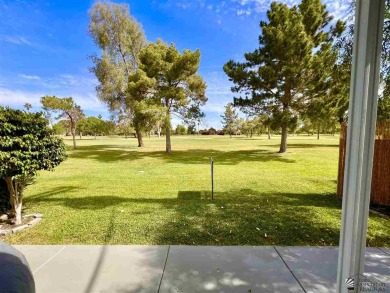 Floor to ceiling windows capture the relaxing golf course views on Yuma Golf and Country Club in Arizona - for sale on GolfHomes.com, golf home, golf lot