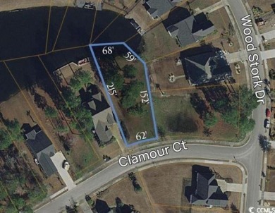 Stunning 0.36-Acre Homesite on a lake in Myrtle Beach's Premier on Wild Wing Plantation in South Carolina - for sale on GolfHomes.com, golf home, golf lot