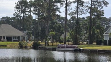 Stunning 0.36-Acre Homesite on a lake in Myrtle Beach's Premier on Wild Wing Plantation in South Carolina - for sale on GolfHomes.com, golf home, golf lot