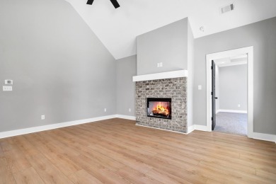 Nestled on the corner lot is an absolute gorgeous new on Canongate At Healy Point Country Club in Georgia - for sale on GolfHomes.com, golf home, golf lot