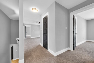 Nestled on the corner lot is an absolute gorgeous new on Canongate At Healy Point Country Club in Georgia - for sale on GolfHomes.com, golf home, golf lot