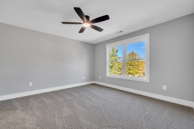 Nestled on the corner lot is an absolute gorgeous new on Canongate At Healy Point Country Club in Georgia - for sale on GolfHomes.com, golf home, golf lot