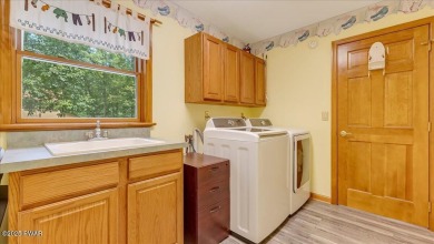 Immaculately maintained home in Tanglwood Lakes with an included on Paupack Hills Golf and Country Club in Pennsylvania - for sale on GolfHomes.com, golf home, golf lot