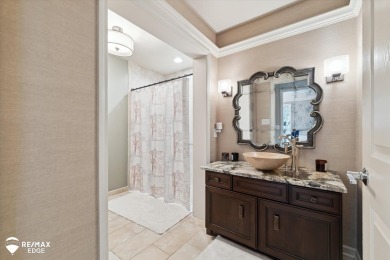 Discover luxurious lakefront living in this beautifully on Indianwood Golf and Country Club in Michigan - for sale on GolfHomes.com, golf home, golf lot