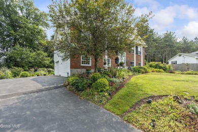 Expansive perennial gardens create a scenic park-like setting on Schuyler Meadows Club in New York - for sale on GolfHomes.com, golf home, golf lot
