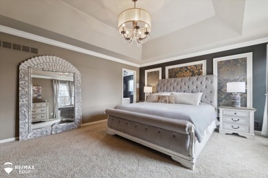 Discover luxurious lakefront living in this beautifully on Indianwood Golf and Country Club in Michigan - for sale on GolfHomes.com, golf home, golf lot