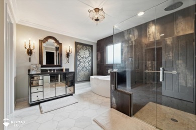 Discover luxurious lakefront living in this beautifully on Indianwood Golf and Country Club in Michigan - for sale on GolfHomes.com, golf home, golf lot