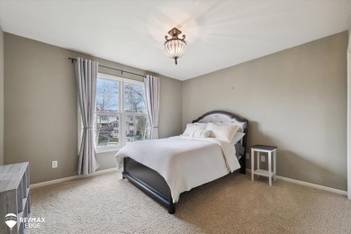 Discover luxurious lakefront living in this beautifully on Indianwood Golf and Country Club in Michigan - for sale on GolfHomes.com, golf home, golf lot
