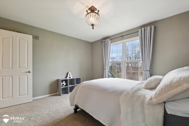 Discover luxurious lakefront living in this beautifully on Indianwood Golf and Country Club in Michigan - for sale on GolfHomes.com, golf home, golf lot