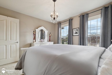 Discover luxurious lakefront living in this beautifully on Indianwood Golf and Country Club in Michigan - for sale on GolfHomes.com, golf home, golf lot