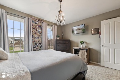Discover luxurious lakefront living in this beautifully on Indianwood Golf and Country Club in Michigan - for sale on GolfHomes.com, golf home, golf lot