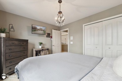 Discover luxurious lakefront living in this beautifully on Indianwood Golf and Country Club in Michigan - for sale on GolfHomes.com, golf home, golf lot
