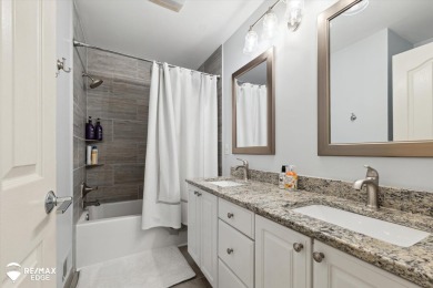 Discover luxurious lakefront living in this beautifully on Indianwood Golf and Country Club in Michigan - for sale on GolfHomes.com, golf home, golf lot