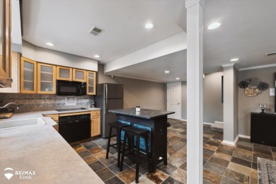 Discover luxurious lakefront living in this beautifully on Indianwood Golf and Country Club in Michigan - for sale on GolfHomes.com, golf home, golf lot