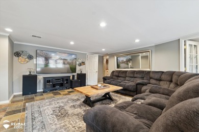 Discover luxurious lakefront living in this beautifully on Indianwood Golf and Country Club in Michigan - for sale on GolfHomes.com, golf home, golf lot
