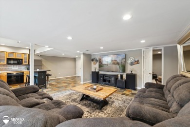 Discover luxurious lakefront living in this beautifully on Indianwood Golf and Country Club in Michigan - for sale on GolfHomes.com, golf home, golf lot