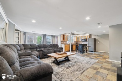 Discover luxurious lakefront living in this beautifully on Indianwood Golf and Country Club in Michigan - for sale on GolfHomes.com, golf home, golf lot