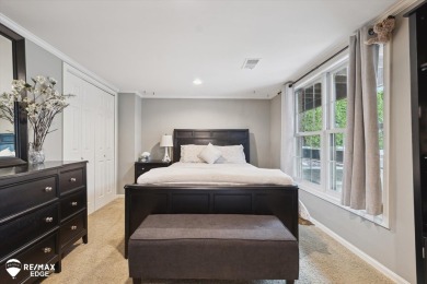 Discover luxurious lakefront living in this beautifully on Indianwood Golf and Country Club in Michigan - for sale on GolfHomes.com, golf home, golf lot