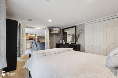 Discover luxurious lakefront living in this beautifully on Indianwood Golf and Country Club in Michigan - for sale on GolfHomes.com, golf home, golf lot