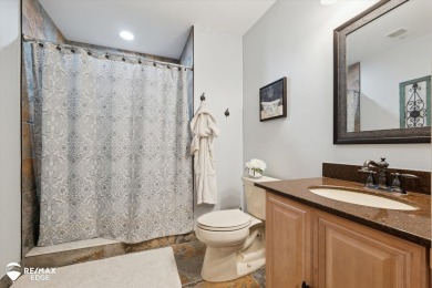 Discover luxurious lakefront living in this beautifully on Indianwood Golf and Country Club in Michigan - for sale on GolfHomes.com, golf home, golf lot