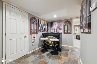 Discover luxurious lakefront living in this beautifully on Indianwood Golf and Country Club in Michigan - for sale on GolfHomes.com, golf home, golf lot