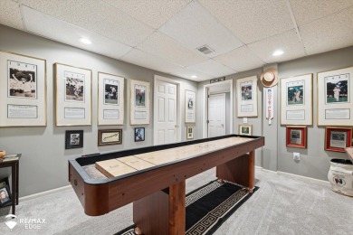 Discover luxurious lakefront living in this beautifully on Indianwood Golf and Country Club in Michigan - for sale on GolfHomes.com, golf home, golf lot