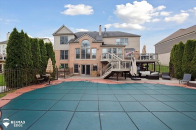 Discover luxurious lakefront living in this beautifully on Indianwood Golf and Country Club in Michigan - for sale on GolfHomes.com, golf home, golf lot