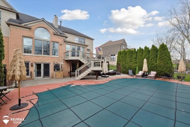 Discover luxurious lakefront living in this beautifully on Indianwood Golf and Country Club in Michigan - for sale on GolfHomes.com, golf home, golf lot