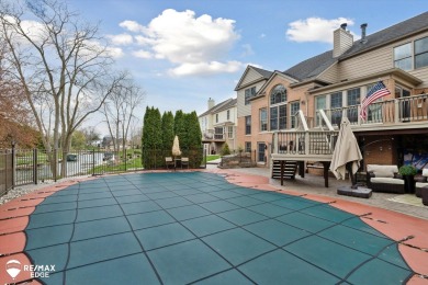 Discover luxurious lakefront living in this beautifully on Indianwood Golf and Country Club in Michigan - for sale on GolfHomes.com, golf home, golf lot