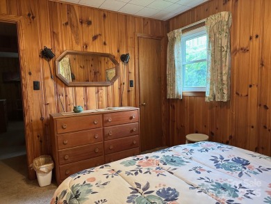 Nestled in the serene beauty of Lake Junaluska, this charming on Lake Junaluska Golf Course in North Carolina - for sale on GolfHomes.com, golf home, golf lot