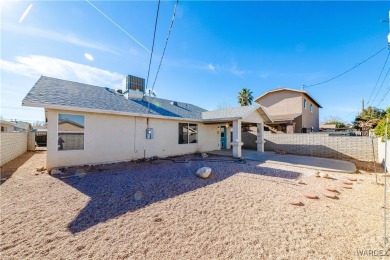 This charming 3-bedroom, 2-bathroom home offers a perfect blend on Cerbat Cliffs Golf Course in Arizona - for sale on GolfHomes.com, golf home, golf lot