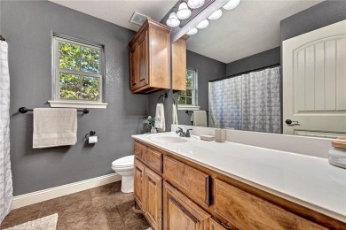 Tucked into the trees on a quiet Bella Vista street, this on Bella Vista - Metfield Golf Complex and Country Club in Arkansas - for sale on GolfHomes.com, golf home, golf lot