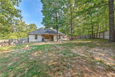 Tucked into the trees on a quiet Bella Vista street, this on Bella Vista - Metfield Golf Complex and Country Club in Arkansas - for sale on GolfHomes.com, golf home, golf lot