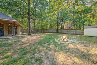 Tucked into the trees on a quiet Bella Vista street, this on Bella Vista - Metfield Golf Complex and Country Club in Arkansas - for sale on GolfHomes.com, golf home, golf lot
