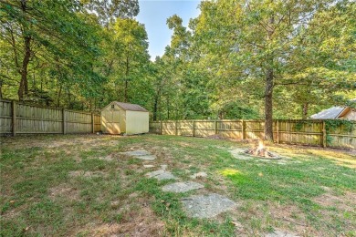 Tucked into the trees on a quiet Bella Vista street, this on Bella Vista - Metfield Golf Complex and Country Club in Arkansas - for sale on GolfHomes.com, golf home, golf lot