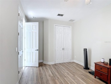 Stunning 5-Bedroom Pool Home on Expansive Corner Lot with Water on Oaks National Golf Course in Florida - for sale on GolfHomes.com, golf home, golf lot