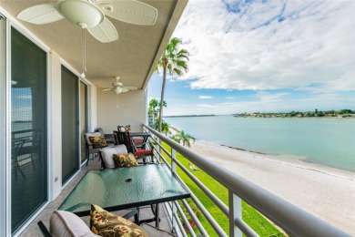 Welcome to paradise! Enter the light and bright condo and drink on Isla Del Sol Yacht and Country Club in Florida - for sale on GolfHomes.com, golf home, golf lot