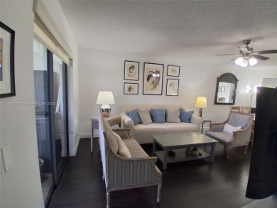MUST SEE! Beautiful completely remodeled penthouse 2/2 condo in on Sunrise Lakes Phase IV Golf Course in Florida - for sale on GolfHomes.com, golf home, golf lot