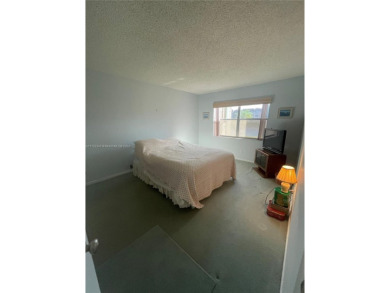 Lovely and well maintained, extended FIRST FLOOR 1/1.5 unit with on Sunrise Lakes Phase III in Florida - for sale on GolfHomes.com, golf home, golf lot